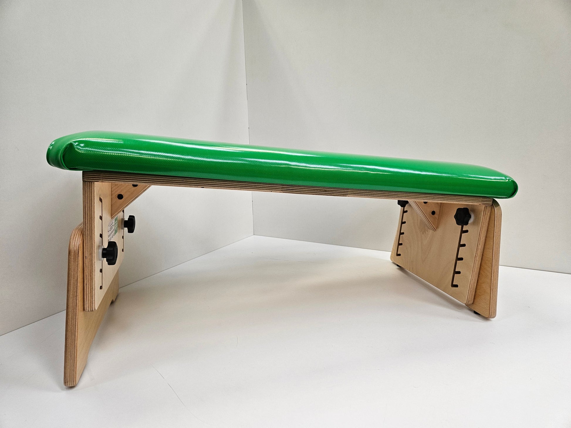 Green TheraPly therapy bench (tilted)